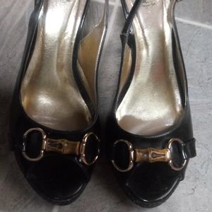 Black sling high heel shoes.